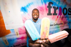 Joseph Thomas Jr and his gourmet pops, Blue Raspberry, Pineapple Mango, and Pink Lemonade