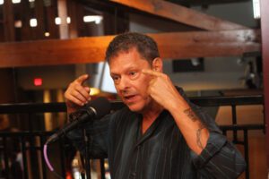 Flip Orley, comic hypnotist, warms up his audience with a 30 minute standup set then launches into his real hypnosis show than can last up to 4 hours